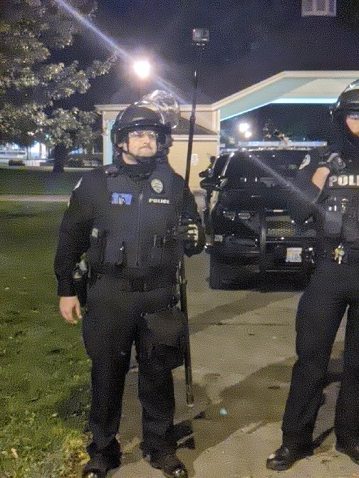 Vancouver police recording from behind the Black Lives Matter group.