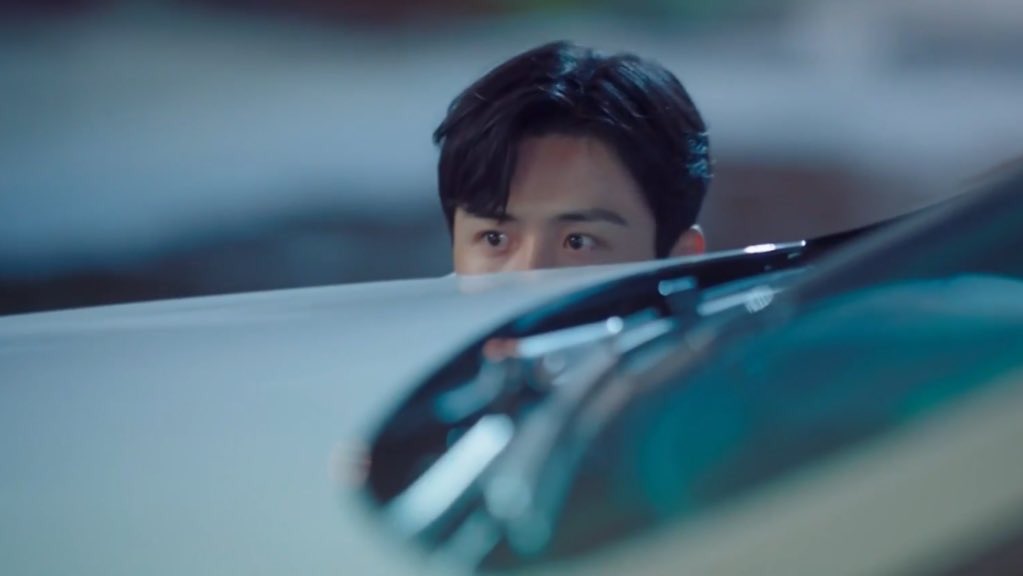 doing what he does best: watching her from afar.