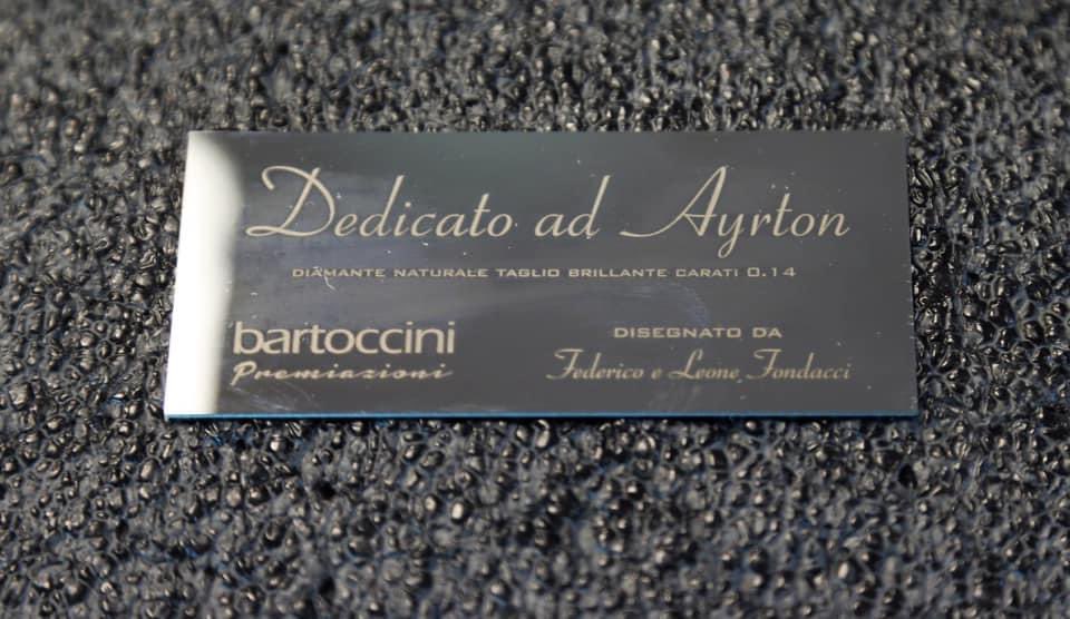 autosport's tweet photo. The trophies for today's race, featuring a .14ct diamond at the site of Tamburello in honour of Ayrton Senna 🇧🇷

#F1 #ImolaGP #SennaSempre https://t.co/cqI2dojLKB
