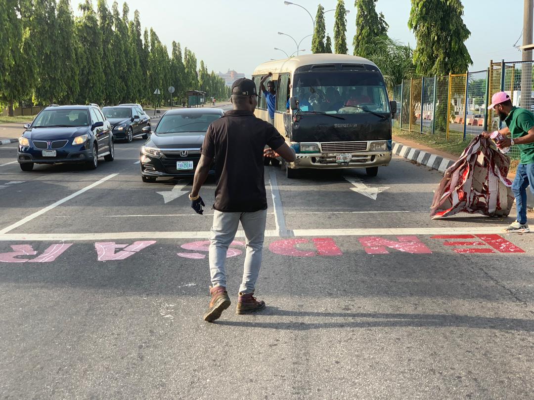 Nerdy_Dopey's tweet photo. You gotta love the coconut heads of Abuja!

Taking the #ENDSARS message to the Police Headquarters. https://t.co/uUCvOD5ZXU