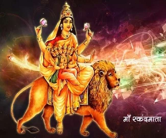 She appears riding on a ferocious lion, but with her hands holding Skanda and assuring her devotees as Abhaya!