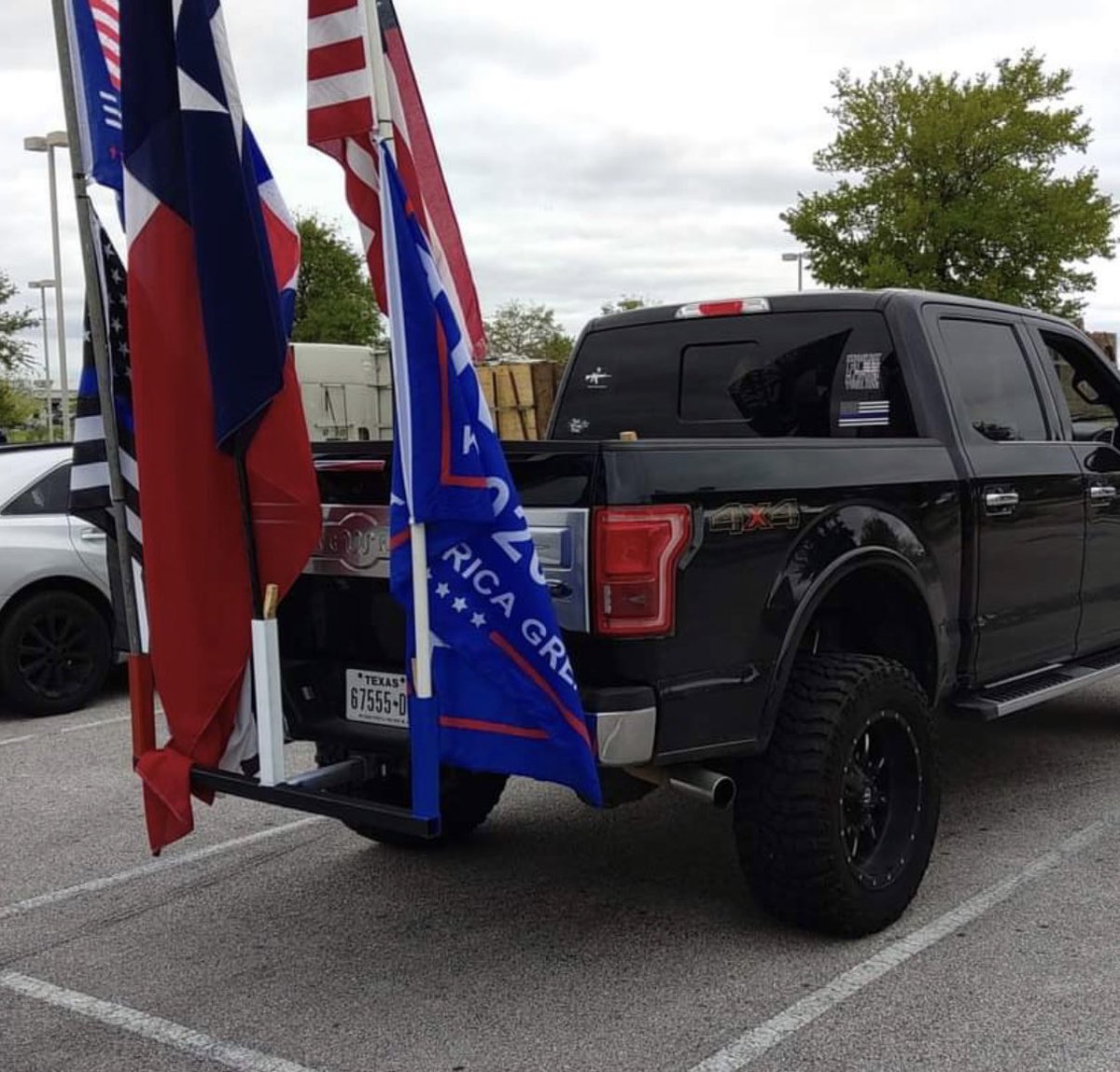 At some point in September, Eliazar Cisneros added the red, white, and blue flag holder hitch to his truck.