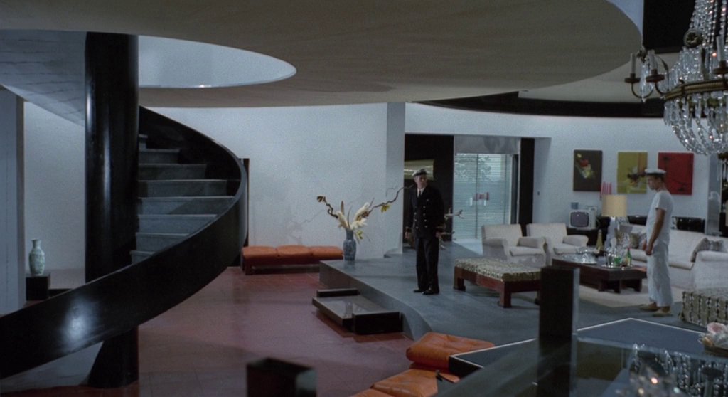 FIVE DOLLS FOR AN AUGUST MOON (Bava, 1970)Production Design: Giuseppe AldrovandiSet Decoration: Giulia MafaiA modernist seaside villa sets the stage for the bourgeois pursuits of its inhabitants. White walls, open plan spaces & eclectic artwork mimic a stylish 60s gallery