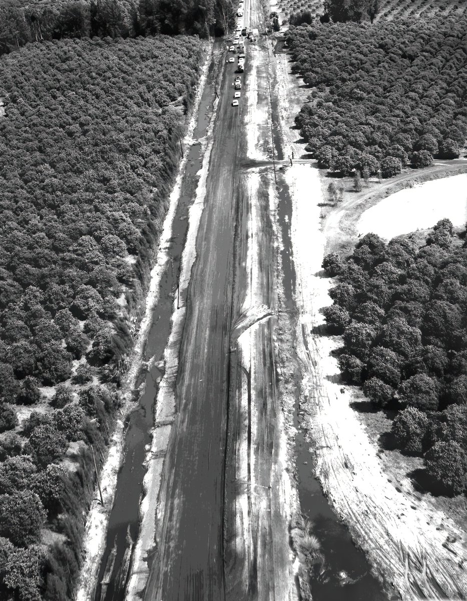 These images taken on the 5th of March 1963 show the road to KSC being layed. I'm confident that the first photo is just past where the Press Accredation Office is now, with the NASA solar farm on the left.