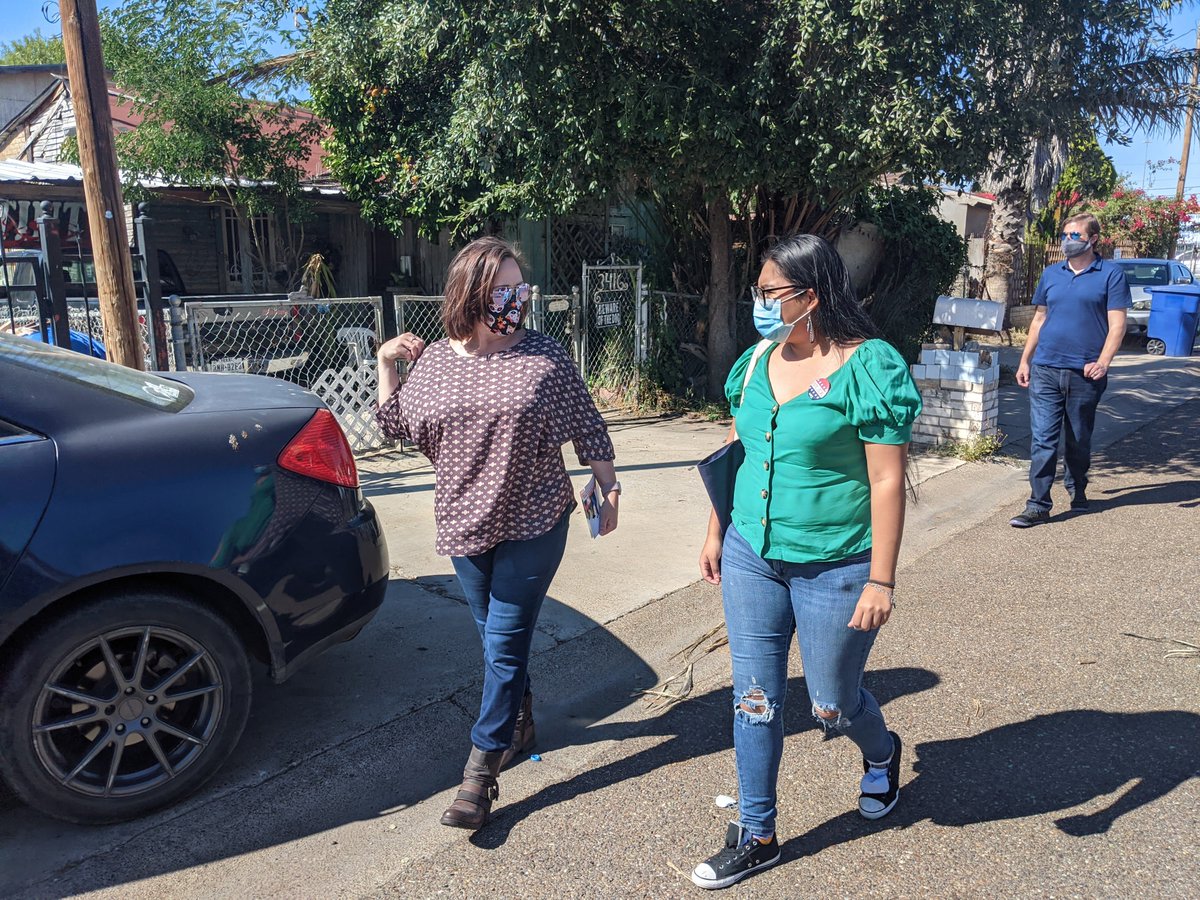 MJ Hegar and Jessica Cisneros going door to door to drop off lit.