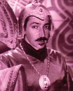 Braxiatela three piece suit. probably a nicer one than he would wear without the robes