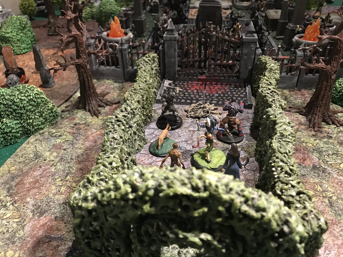 david_b_moffit's tweet photo. Graveyard of the Damned: Hedge entrance section- #dwarvenforge did the hedges and the terrain trays under them. Trees, bushes, stumps, rocks by #monsterfightclub Ruined tower was an eBay purchase & painted with Pokorny paints. Minis by #wizkids #wotc #bombshellminiatures #cmon https://t.co/g8crPnETXq