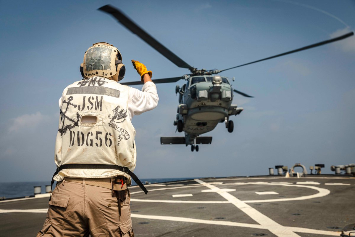 An @Australian_Navy MH-60R Seahawk helicopter from #HMASBallarat lands aboard #USSJohnSMcCain in the Andaman Sea on Sunday as the two ships continued integrated operations that began last week in the South China Sea. #NavyPartnerships