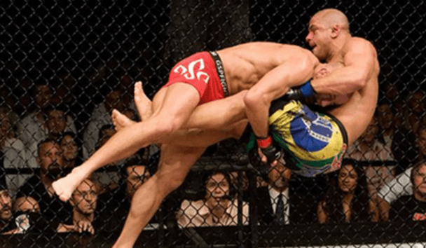 MMAShark3's tweet photo. Double-leg takedown involves pushing your head against your opponent’s side, wrapping up behind their knees with your hands, and pulling their legs up and away from the ground while pushing their upper body downwards with your head. 
#doublelegtakedown #BJJ https://t.co/lWgg9Lq1ts