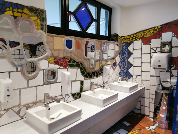 nonstandardmcd's tweet image. this location was designed by notable austrian architect fiedensreich hundertwasser, featuring his signature bold colors and organic forms. he would go on to do a second project for mcdonald's in the form of the ronald mcdonald house in essen, germany (last photo).