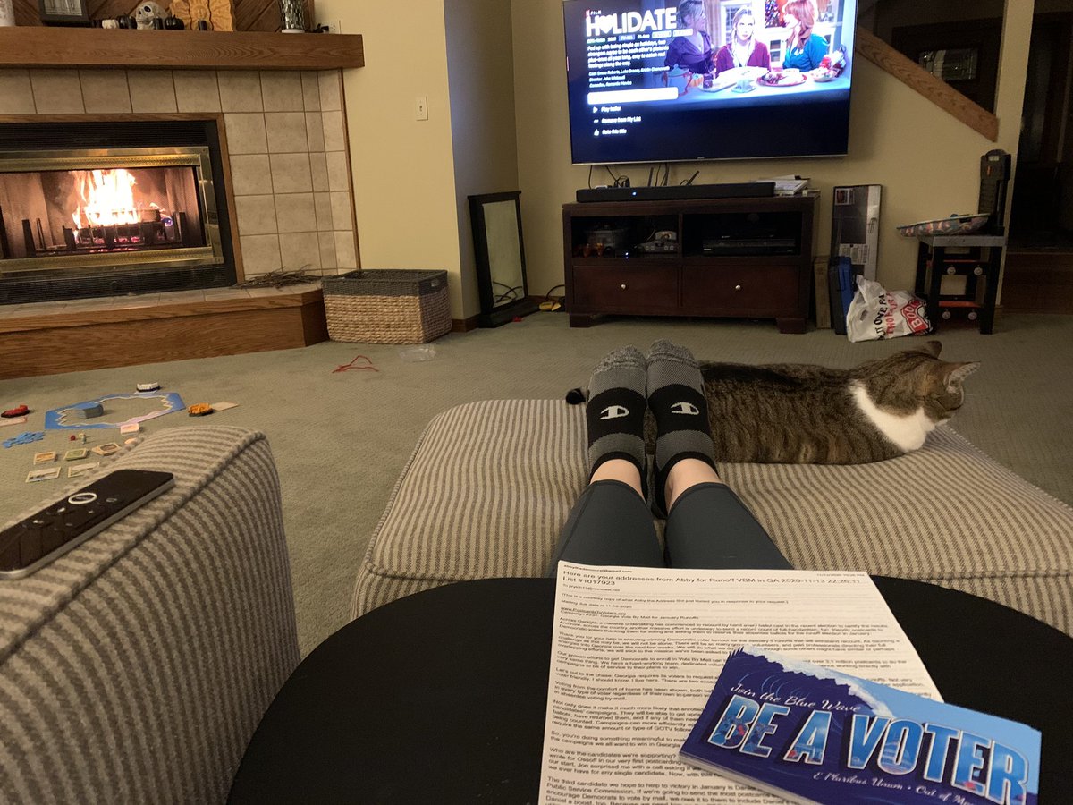 JLAustin13's tweet image. Fire in the fireplace, cat at my feet holiday romcom on the TV, and #Postcardstovoters for @ossoff, @ReverendWarnock, and @BlackmanDNA! Happy Holidays! 

#Bluewave2020 #GeorgiaRunoff