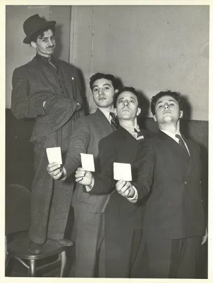 PINK SLIPS ON PARADE! (Mr. Hooper, 3rd from left).