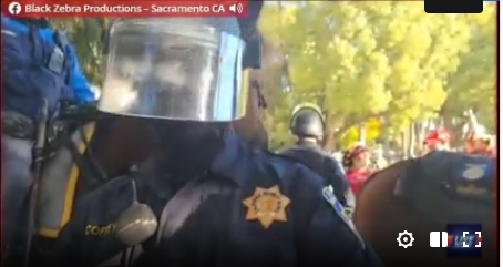 valkyrie_falls_'s tweet photo. #Sacramento - 

On stream: This officer pushed a member of the Press and put a hand on their camera. This was live on stream. Identified as "Officer Coffey."  #BlackLivesMatter #FTP #ACAB https://t.co/XqUj8WaCSv