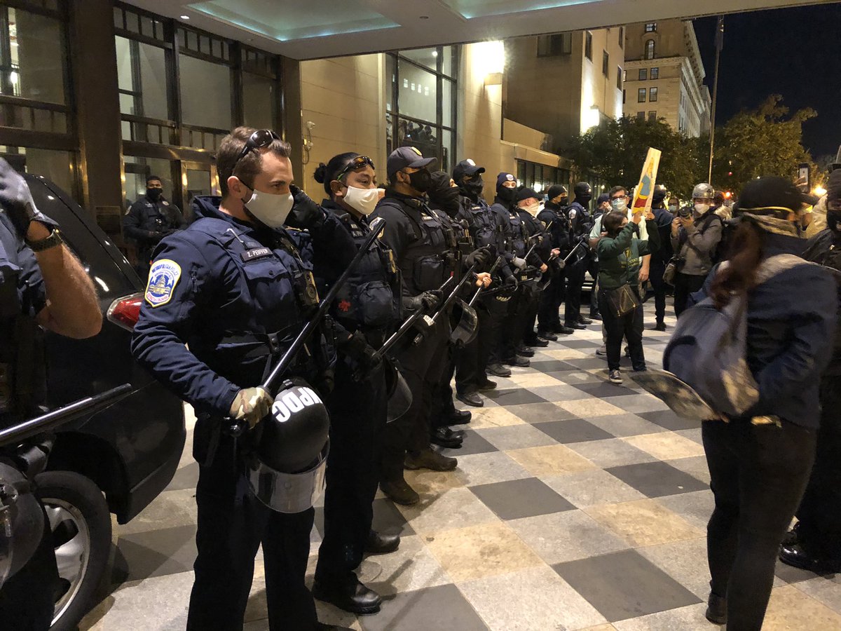 Police are now guarding The Capitol Hilton near the White House after a confrontation near the entrance. Trump supporters are inside holding up flags as counter protesters are outside yelling “Fuck Trump!”