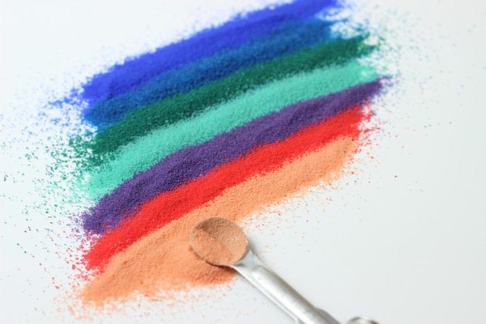 The red beads are jojoba beads/esters - made of jojoba oil, vitamin C and vitamin E! GentleMoisturisingEnvironmental-friendly choice!Light reading on  https://www.soapqueen.com/bath-and-body-tutorials/tips-and-tricks/jojoba-beads-vs-microbeads-whats-the-difference/