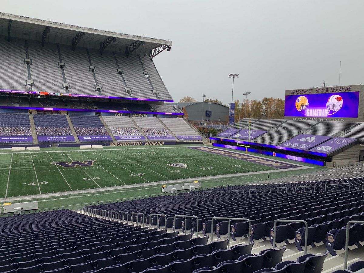 UWVideo's tweet photo. Husky Football is back! Our team is gearing up for the game. It’s a strange sight to see the stands empty but we know you’re cheering them on from home. Glad to have you back on the field! Go Dawgs! @UWAthletics @UW https://t.co/GAbv95Undh