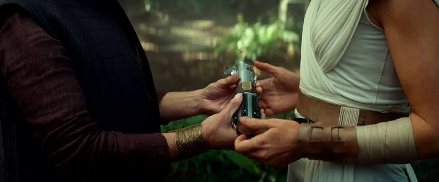 It told us that Rey needed to earn Luke's lightsaber, one that she had already earned, even though she had a bad relationship with Luke and didn't really value his opinion; it also made her own power and strength into something that she instead inherited from a man