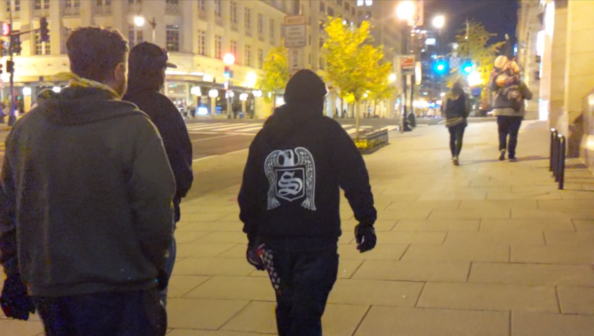 Wandering the mostly-empty streets and pass someone in bloc but also a Skrewdriver hoodieI get the back of itSkrewdriver, if you weren't aware, is a Nazi band, for Nazis