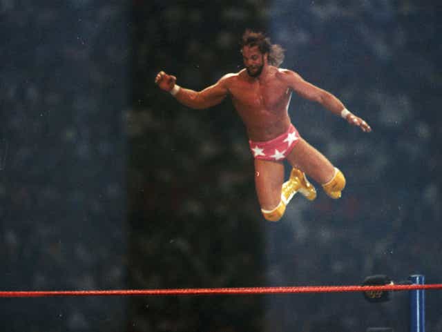 An iconic shot of Randy Savage delivering his patented Flying Elbow Drop at WrestleMania III.