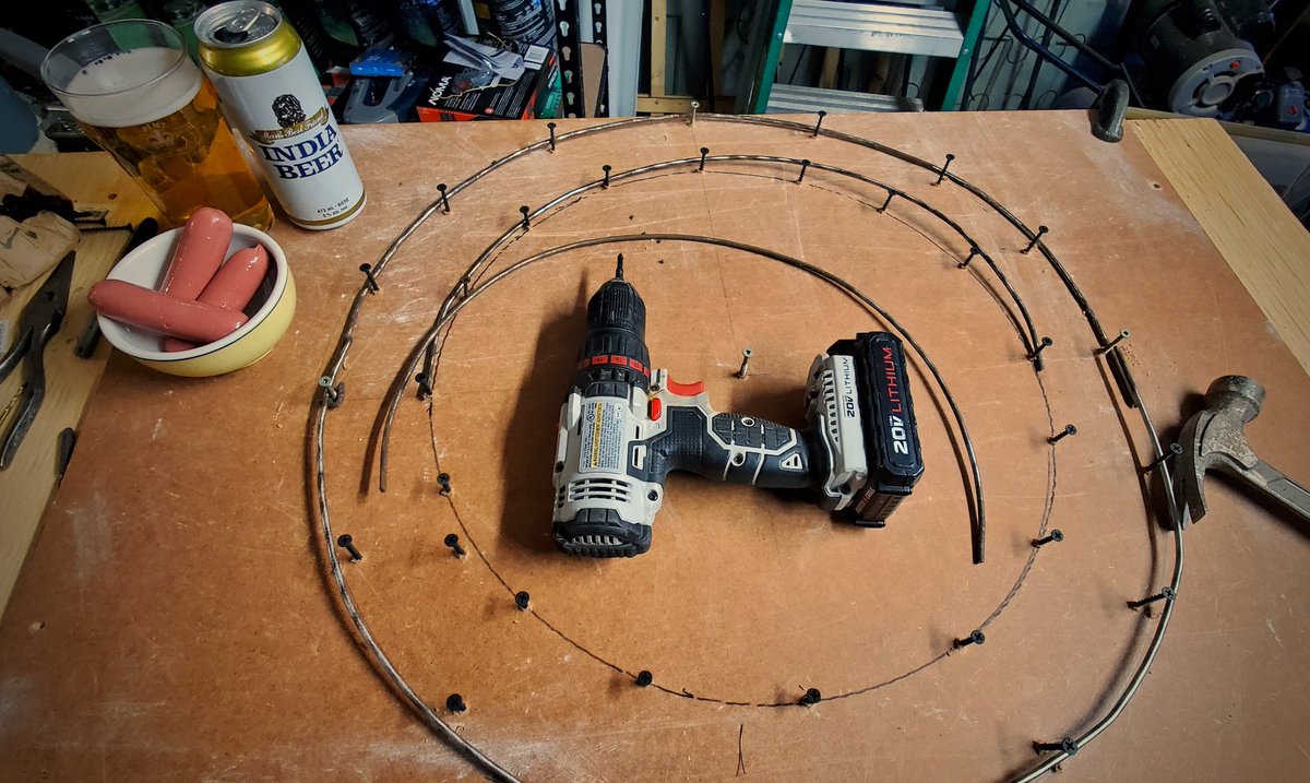 ToddGBaker's tweet photo. I guess wire wreath frames are the new bread yeast. Michael's & dollarama sold out long ago. Time to make my own. Plus guest appearance...India & Grog Bits! 🤪 #oldbedframe https://t.co/l98wiV4Q5J