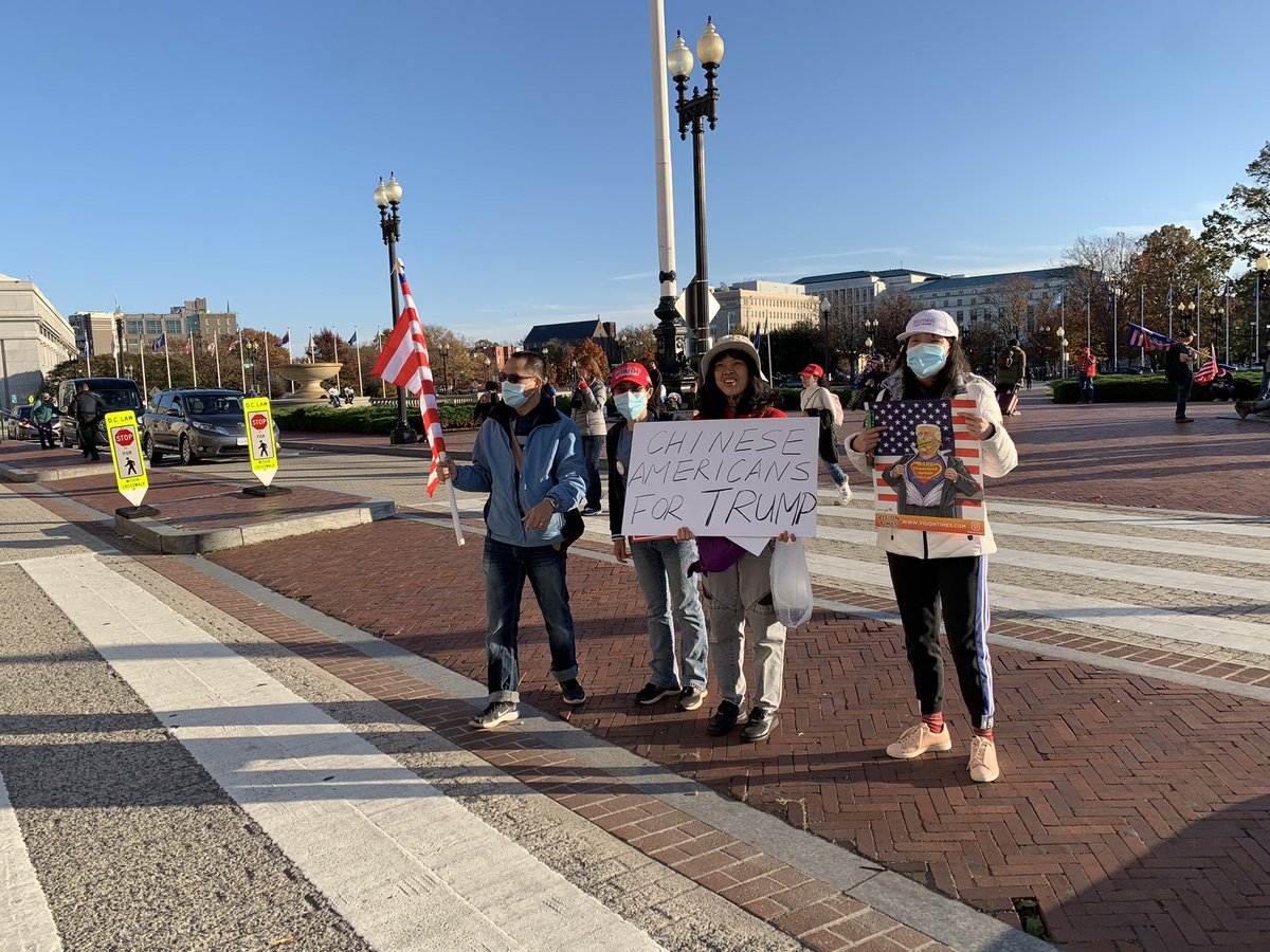 GasPassChic's tweet photo. Save Our Children sign, Proud Boys train politely moving through crowd to the podium, Chinese Americans https://t.co/BU45zUCn9e