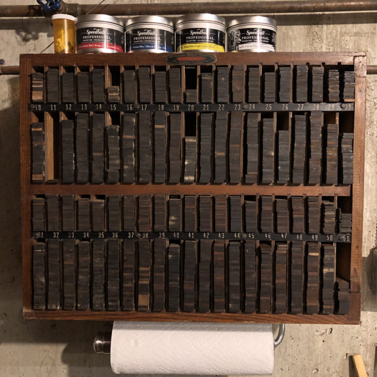 MDeSantisDraws's tweet photo. I hung my furniture cabinet on the wall next to my printing press (“furniture” refers to the wood spacers used to arrange stuff on the press bed). Let’s hope this never falls down! #letterpress #woodtype #printing #printmaking https://t.co/xv7z6haAHZ
