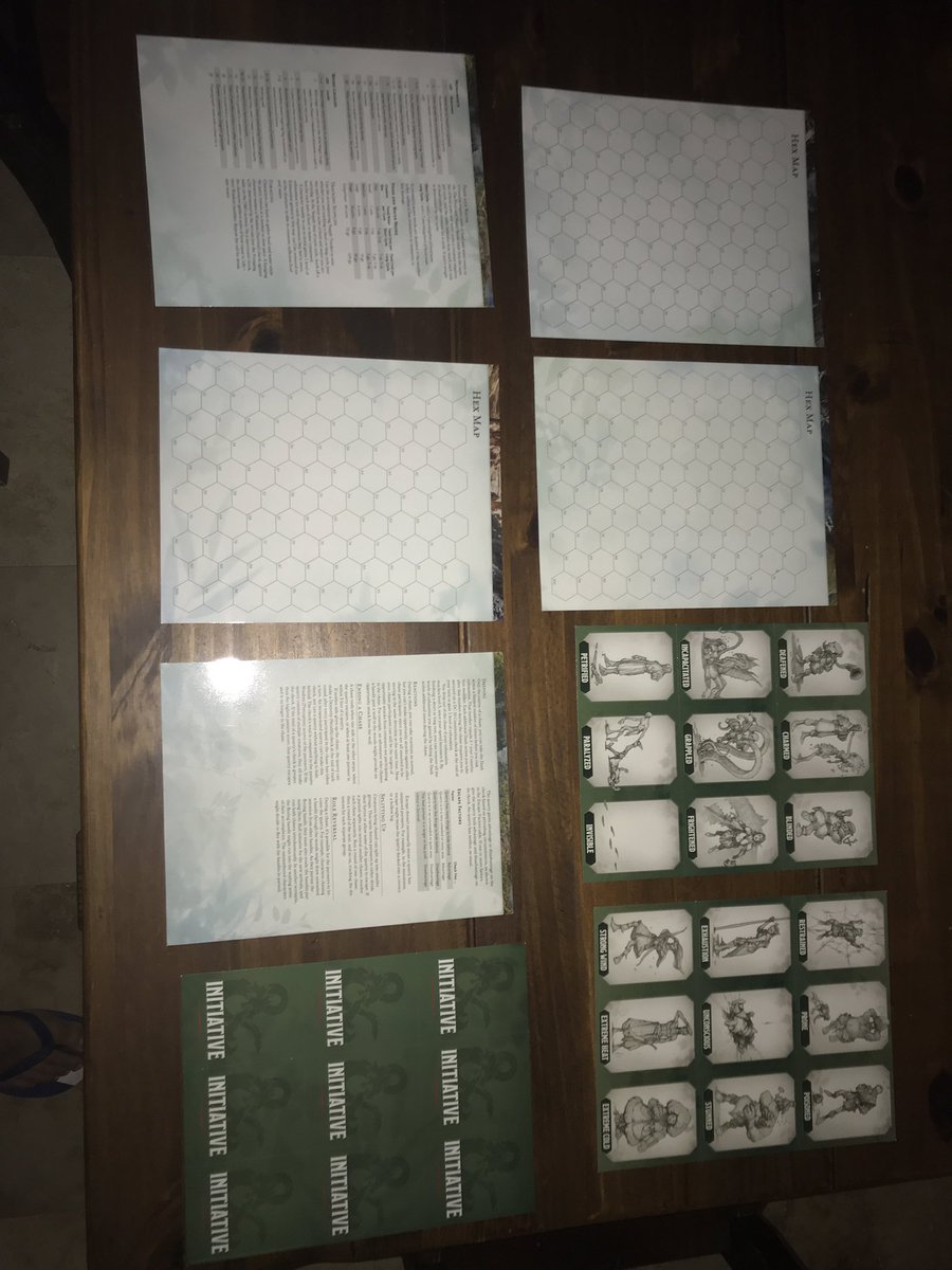 We also get 5 glossy double sided pages. Wilderness Chases, double sided hex map, Actions in Combat, Wilderness Journey rules, Supply Tracker. Some of these have the hex map on the flip side.