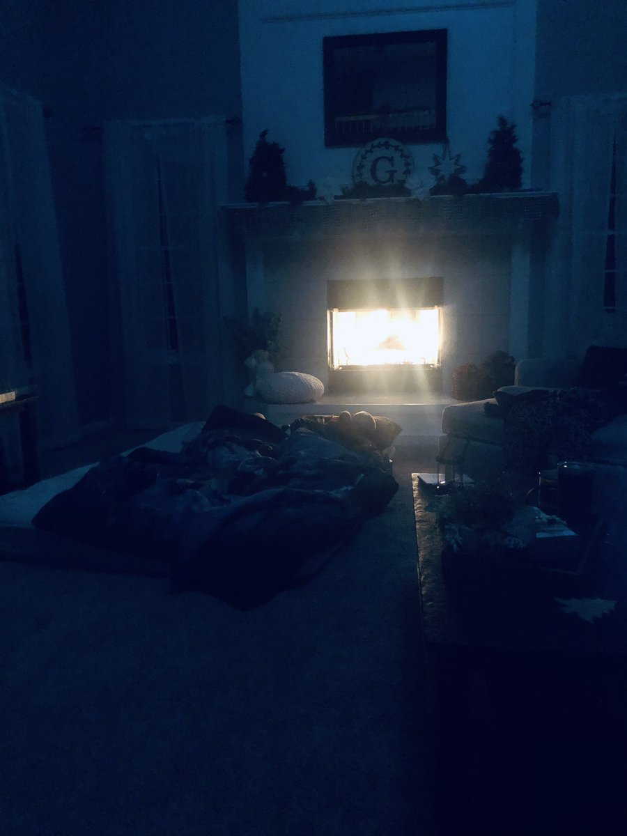 jessicagriffen's tweet photo. This is what you do when you’ve had no power or heat since 12:45pm! Hunker down by the fireplace and try to sleep. Praying we get power back soon #only2020 https://t.co/6ZCOvu6pru