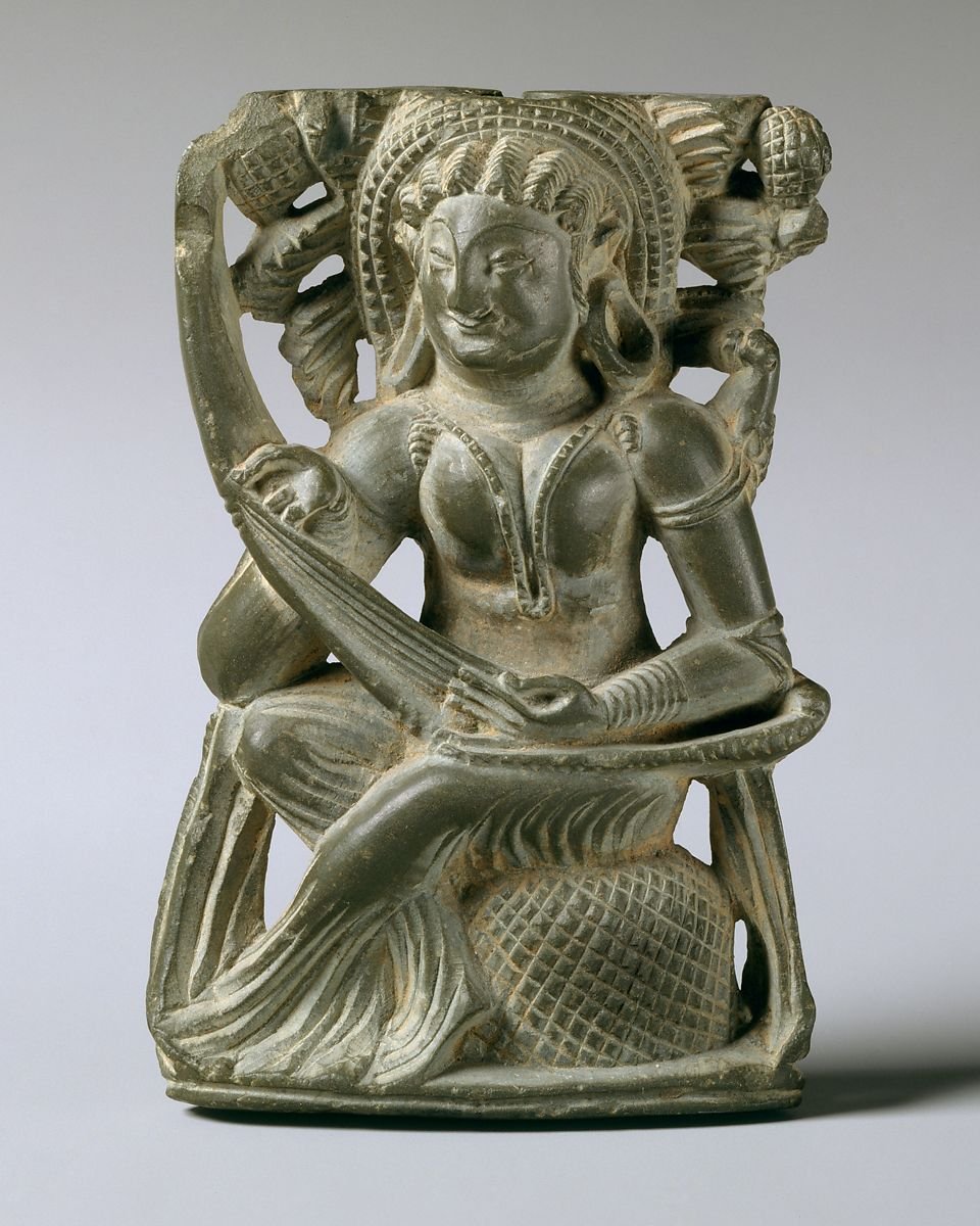 Woman Playing Lute(stringed instrument)6-7th centuryJammu & Kashmir,  @metmuseum sites it from ancient kingdom of Kashmirserved as mirror handle: has a hole drilled from top to receive mirror fixture. Similar objects found Khotan, Central Asia, presumably legacy of trade links
