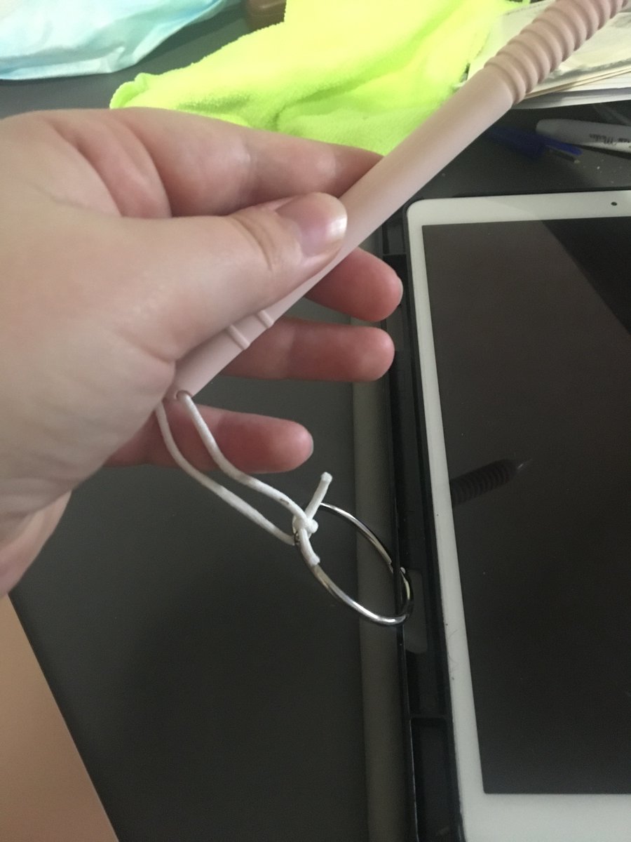 residentdralice's tweet photo. Made a hack for not losing my Apple Pencil. The tie for an old mask is tied thru the loop, which is then looped through what used to keep measuring cups together , opens easily so I can write (they live in cupboard) and attaches to case!! #adhdtwitter #iloseeverything https://t.co/92Pu2c9hp3