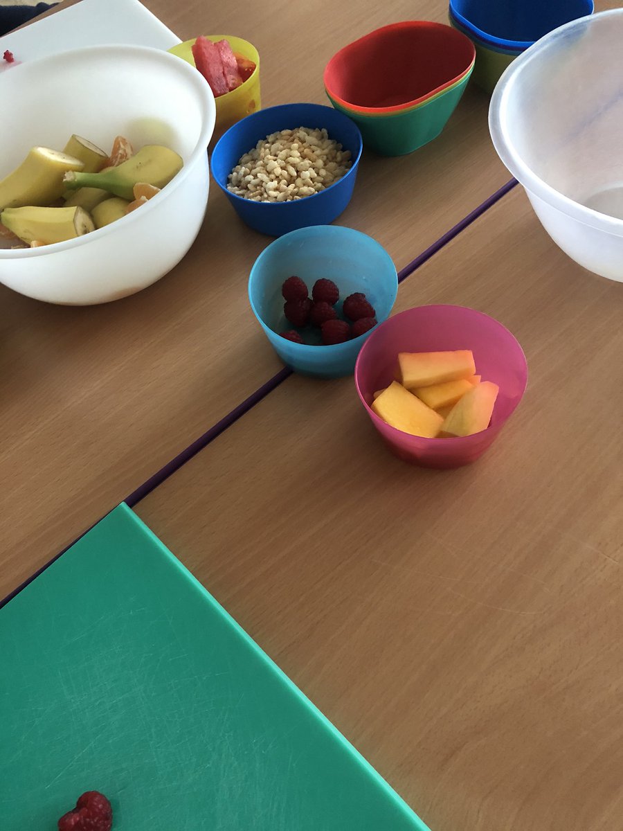 KitchenTeaching's tweet photo. Today our 2 year olds had their first cooking session, they are making a fruit salad with a Rice Krispie topping. They have very good chopping skills. https://t.co/6iUadFI0M6