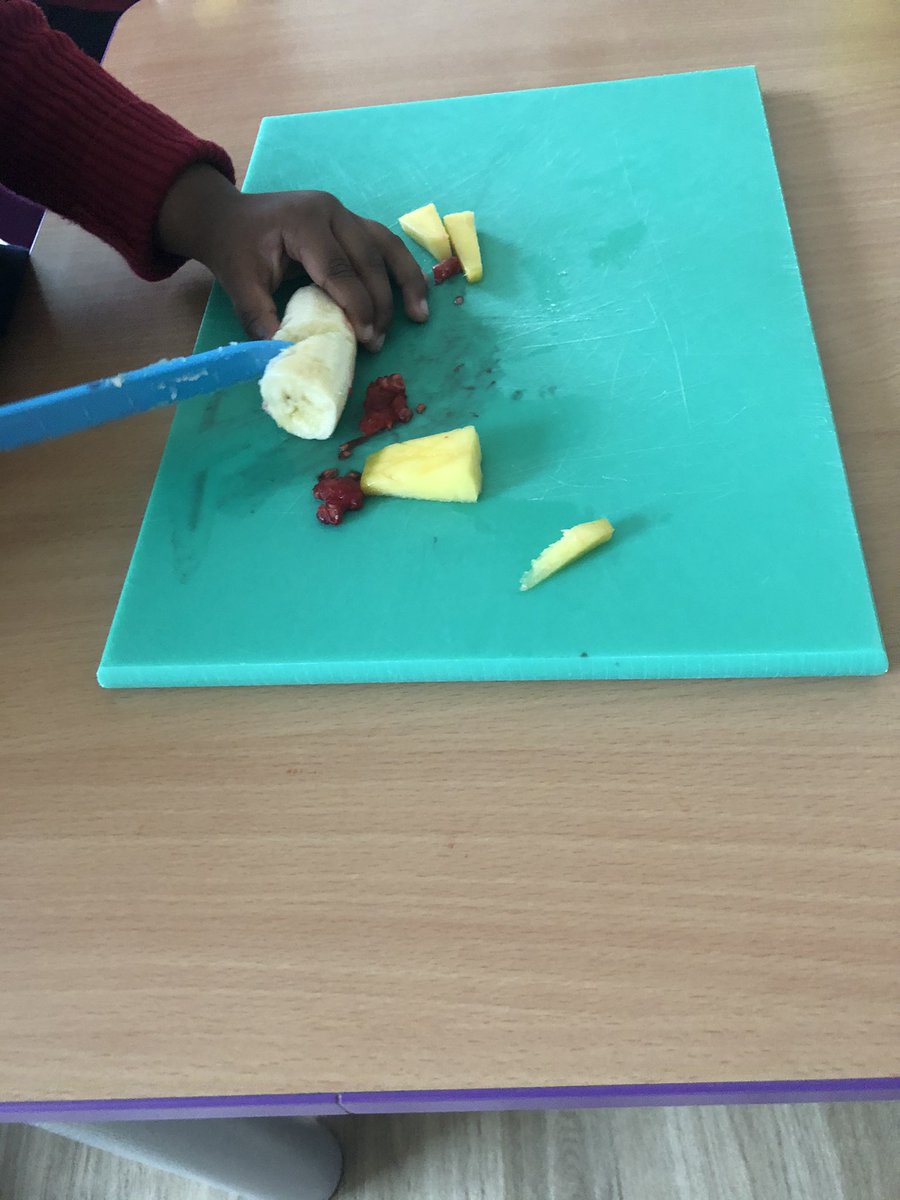KitchenTeaching's tweet photo. Today our 2 year olds had their first cooking session, they are making a fruit salad with a Rice Krispie topping. They have very good chopping skills. https://t.co/6iUadFI0M6