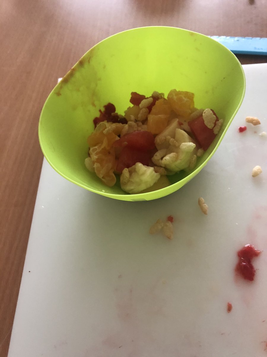 KitchenTeaching's tweet photo. The children chopped bananas, mango, raspberries, melon and clementines, with a sprinkle of Rice Krispies on top. https://t.co/s2FaL3QkDk