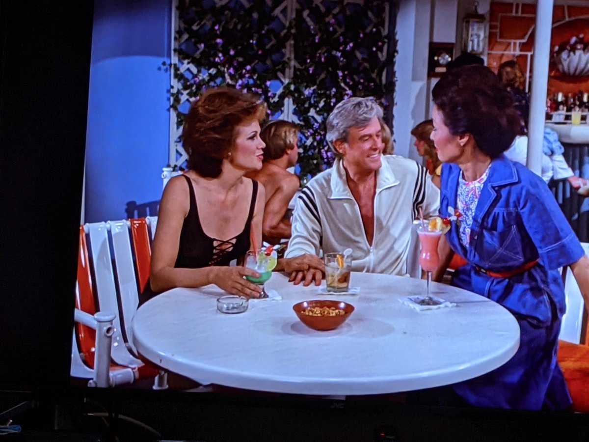 I spy is married, but the woman on the left keeps hitting on him, so Julie and Vicky are going to try and set her up with doc so she'll leave the married dude alone because that's the only way you could possibly solve that.