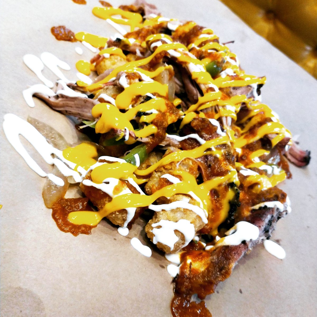 sugarfirewesty's tweet photo. "Are you gonna eat your tots?" What if they're "Nacho Tot-chos!" Tater-tots nachos w/ from-scratch Smoked Tomato Chipotle Salsa, sour cream,  onions, peppers, smoked pulled pork, n cheese sauce! Grab yours for$10.99!
#sugarfirewesty #weeklyspecial #totchos #smoked #treatyoself https://t.co/1LygAYq35n