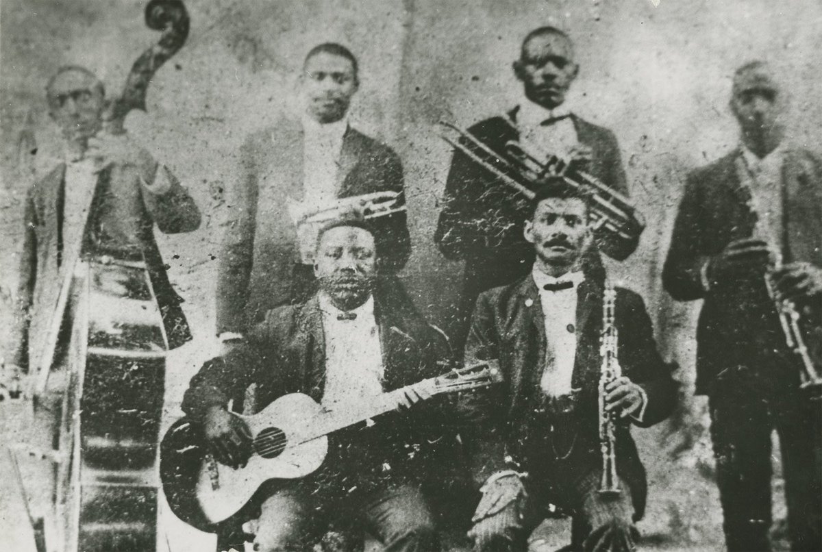 nolajazzmuseum's tweet photo. Remembering Buddy Bolden, first man of jazz, who passed away at the former Louisiana State Insane Asylum in Jackson, Louisiana on this day in 1931. He was 54. 

📷: The only known photograph of Buddy Bolden, standing back row and second from left, horn in hand. https://t.co/l5gDuIqFXz