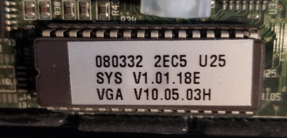 Another common place you'd see EPROMs was holding the BIOS of PCs, like this one for a Packard Bell 486. EPROMs usually had stickers over them because it prevent any ambient light from affecting the chip.