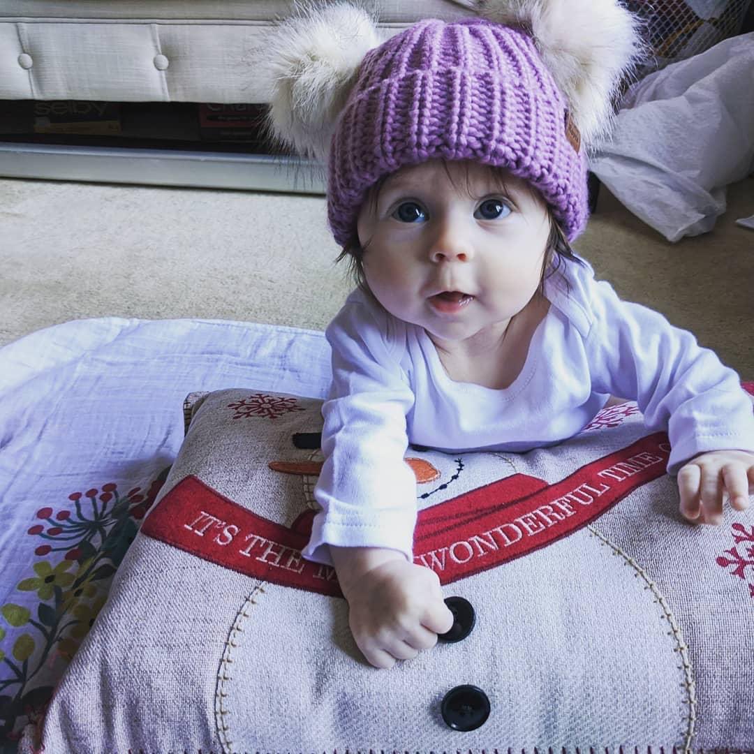 DougRhind's tweet image. She’s just too cute and this smile will brighten your day... compliments to @Roots for the adorable toque.