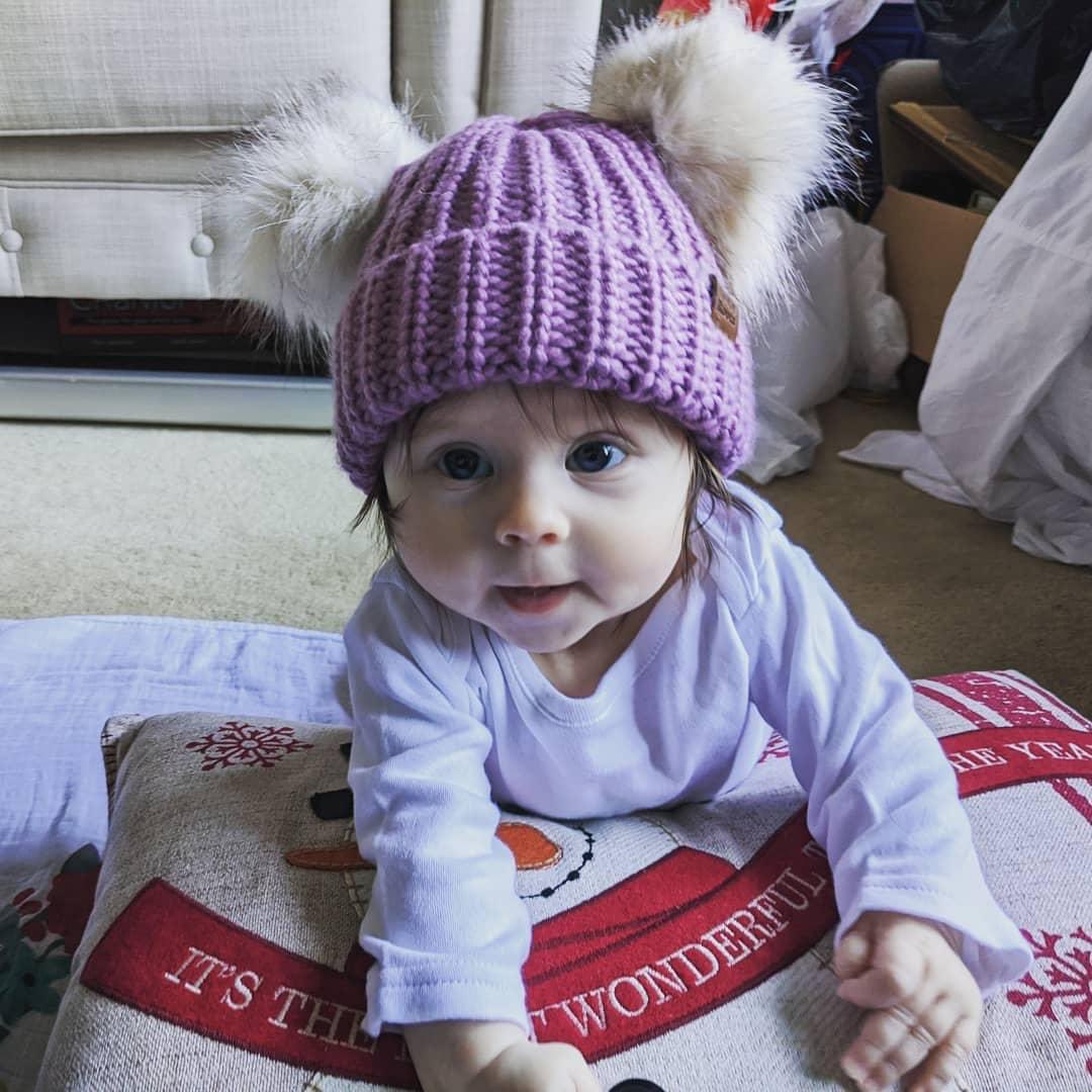 DougRhind's tweet image. She’s just too cute and this smile will brighten your day... compliments to @Roots for the adorable toque.