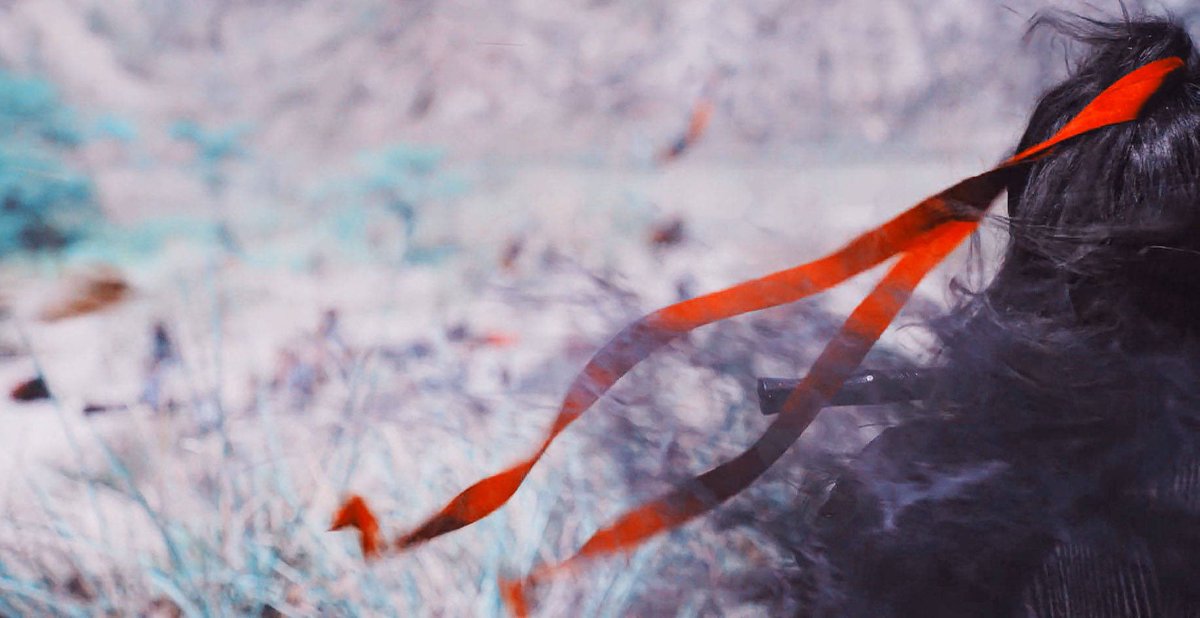 he says that he can only stay with him for so long, that he has to leave him there, but he still held onto the red ribbon.