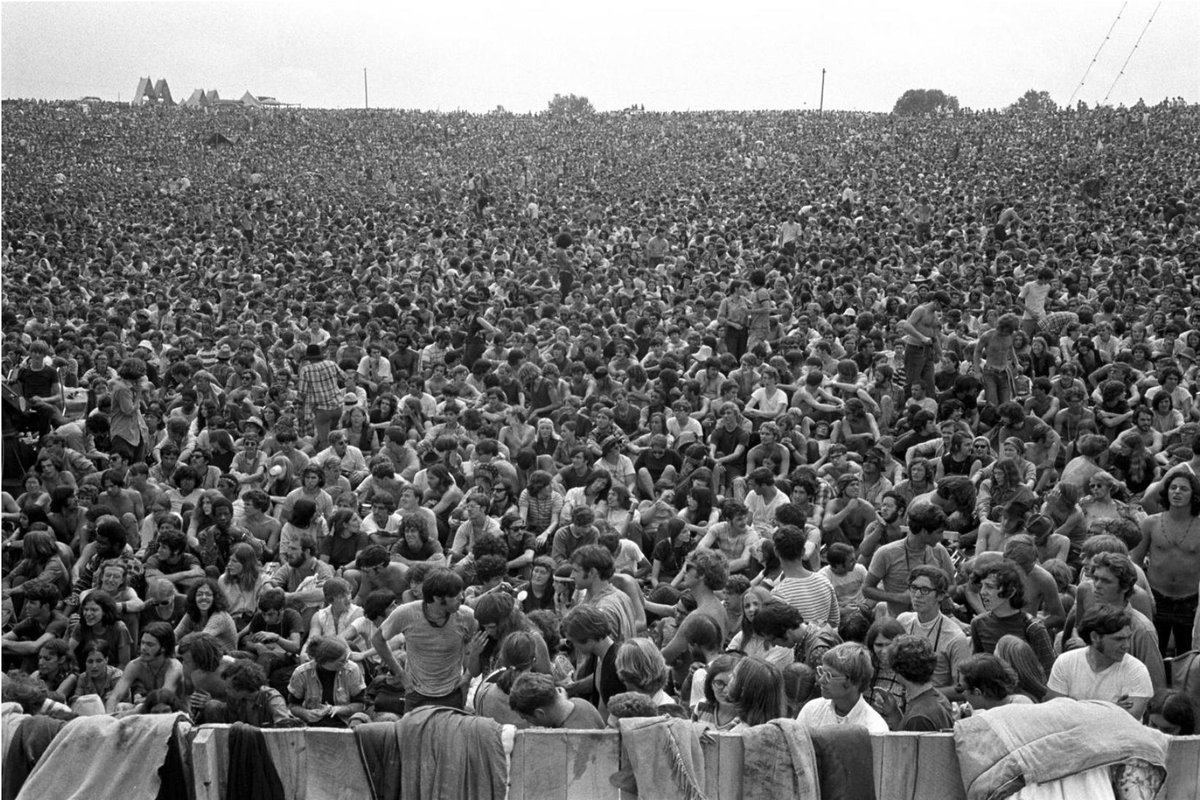 "With the widest angle lens I had at the moment - probably only 24mm - I tried to capture the feeling of 300,000 plus folks gathered in peace for the purpose of enjoying themselves and the music."This shot by Baron Wolman is my favourite Woodstock photograph.  #RIP