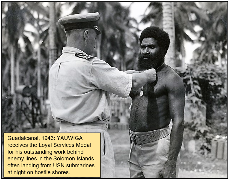 On Bougainville he operated far behind enemy lines.In 1945 Yauwiga was in a hidden camp when 80 locally-guided Japanese stealthily advanced.He noticed their approach and enabled his group to escape with essential equipment.Then with 2 others, he killed 25 Japanese in 15 mins.