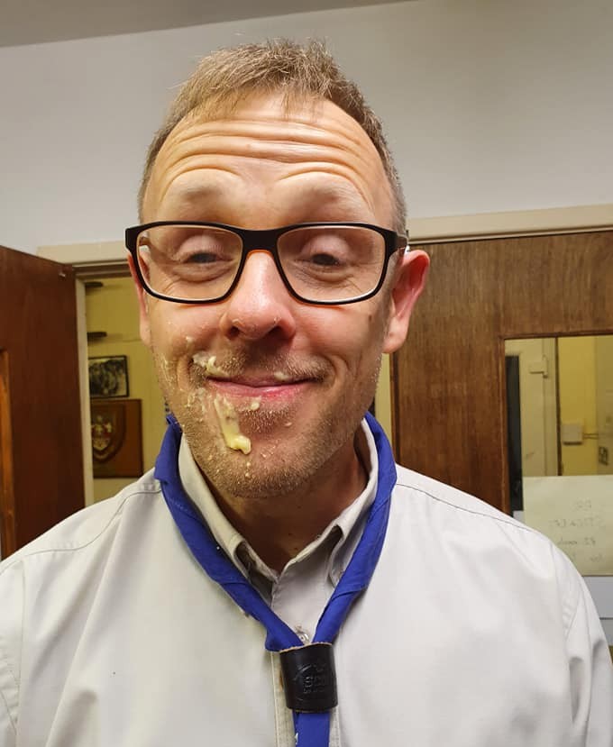 10thWarrington's tweet photo. Scouts enjoyed a game of eat the donut without licking their lips last night.  We decided to feed this leader the donut using a gloved up litter picker.  No idea how on Earth they ended up with custard everywhere!
#leadersareawesome #scouts #10thwarringtonscoutgroup https://t.co/HcXgZR1zLk