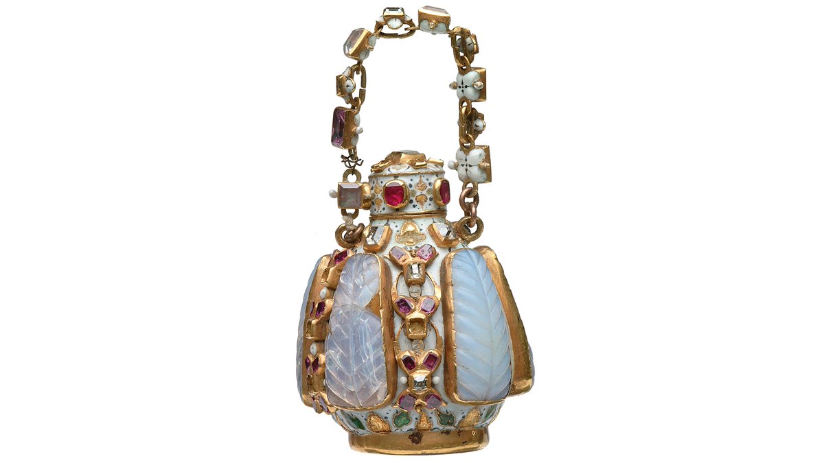 This scent bottle may be small, but that didn't stop the creator from decorating it richly. It's a gold, enamel and gem-set flask with a screw top and chain, and would have contained perfume made from flower distillations and spices.