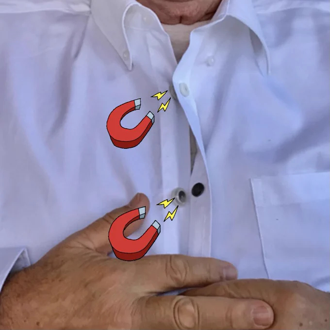 This is a zoomed up image of a white man wearing traditional white button-down shirt that has been transformed with magnetic button adaptors and now the shirt is magnetic! There are magnetic clip art showing that the buttons are now magnetic.