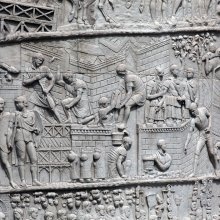 Trajan is shown in the friezes nearly 60 times, emphasizing his role throughout all stages of the war (2). Scene 12 shows Trajan overseeing fort construction (3) This scene presents the Romans as hard workers who work together through even the less "glorious" aspects of war"