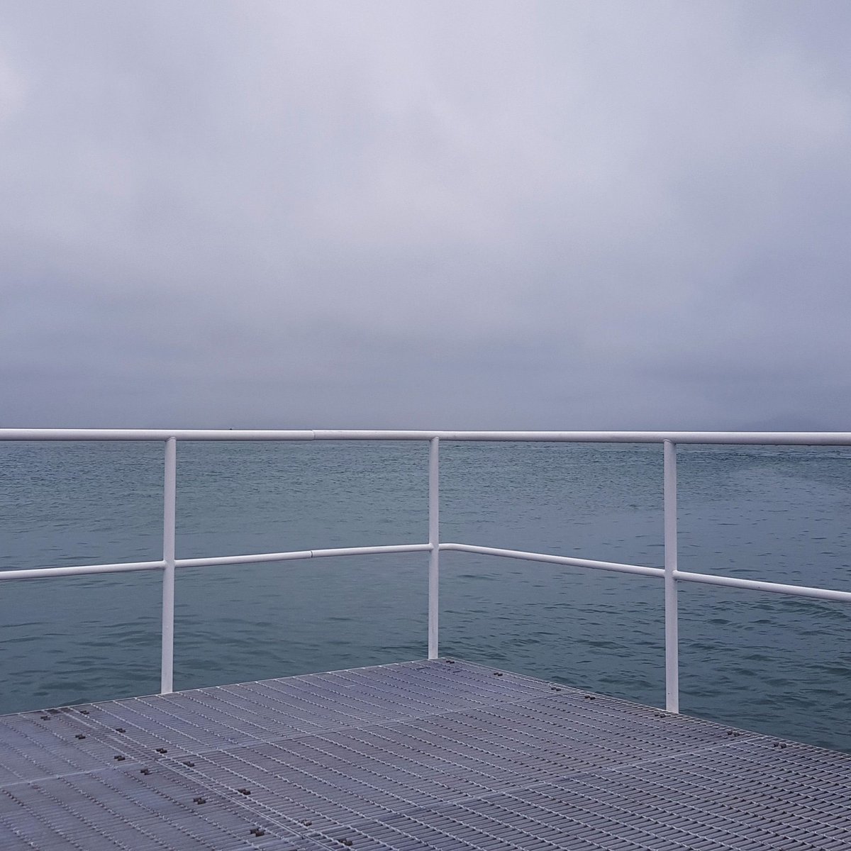 OffcutStudioUK's tweet photo. Greys and blues looking good at this sea jetty on the island of Naoshima. Simple lines and complementary colours like these are the inspiration for the sustainable home goods we make from recycled textiles. https://t.co/kcEYe077iz