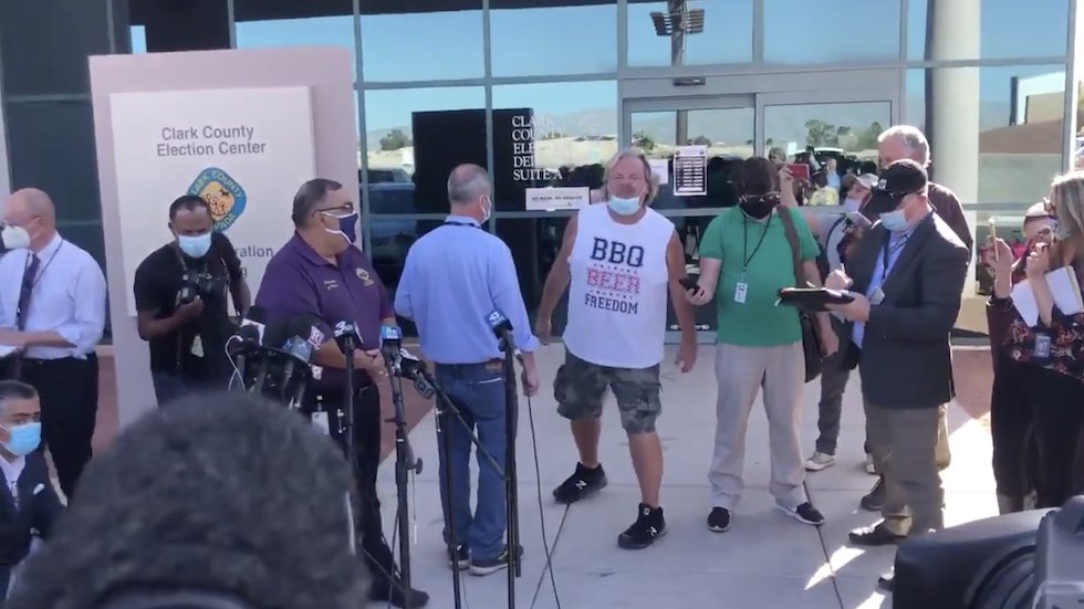 thehill's tweet photo. WATCH: Man in "BBQ, BEER, FREEDOM" shirt interrupts live on-air Nevada election update, screams Biden is "stealing the election" https://t.co/9bzhqRhMpR https://t.co/GFhYnTnnEI