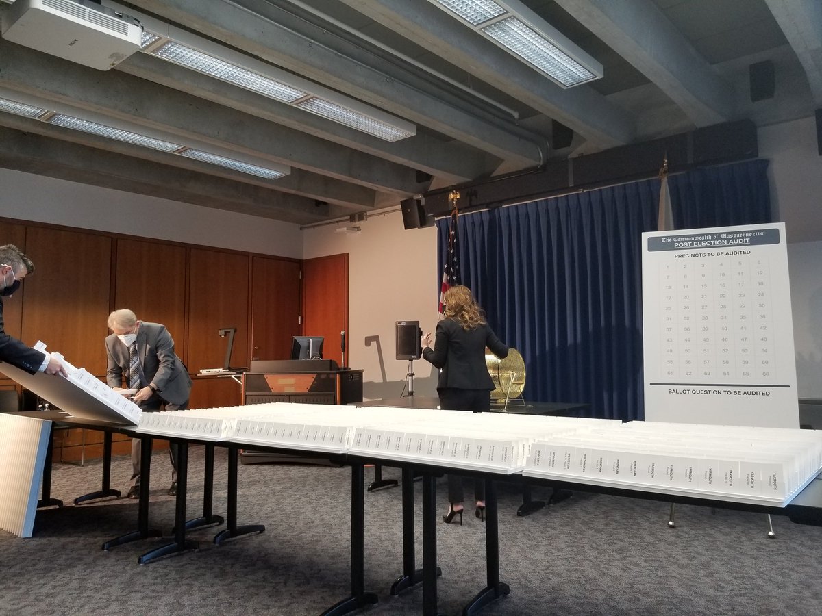 The cards are being removed from their display boards and are being placed into the drum for the drawing, which will happen in just a few moments.Many of our clerks are watching from their offices, waiting to find out which cities and towns are picked.