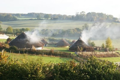 If for instance you approached an Iron Age roundhouse village, or any other village with pre chimney thatched roof houses, you would have seen something like this. The houses looking like they are on fire...